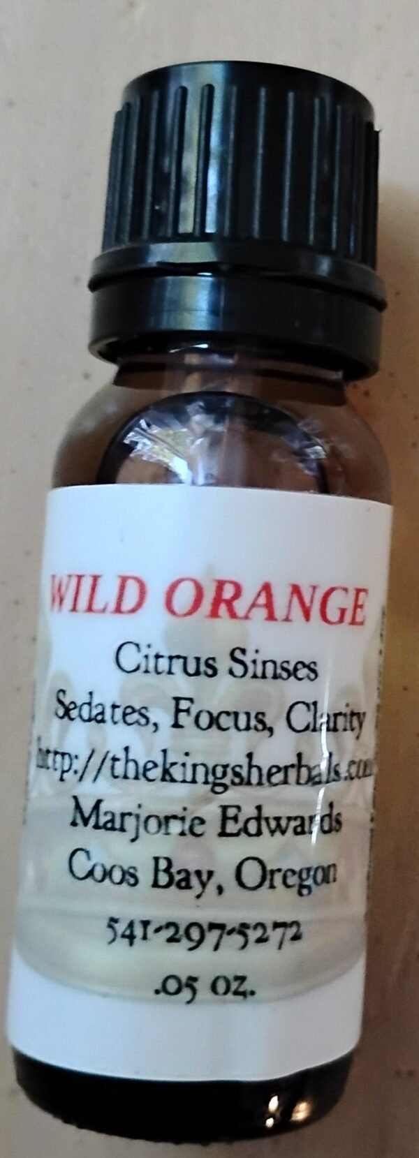 A bottle of wild orange is shown with label.