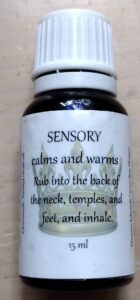 A bottle of aromatherapy oil with the label for sensory.