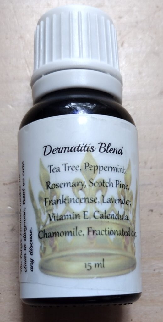A bottle of dermatitis blend with ingredients listed.